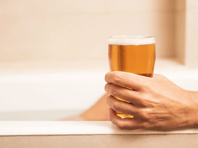 A glass of beer waiting to be poured as a hair rinse