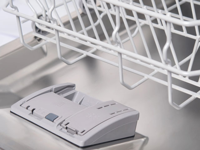 An empty dishwasher waiting to be filled with dishes to be cleaned